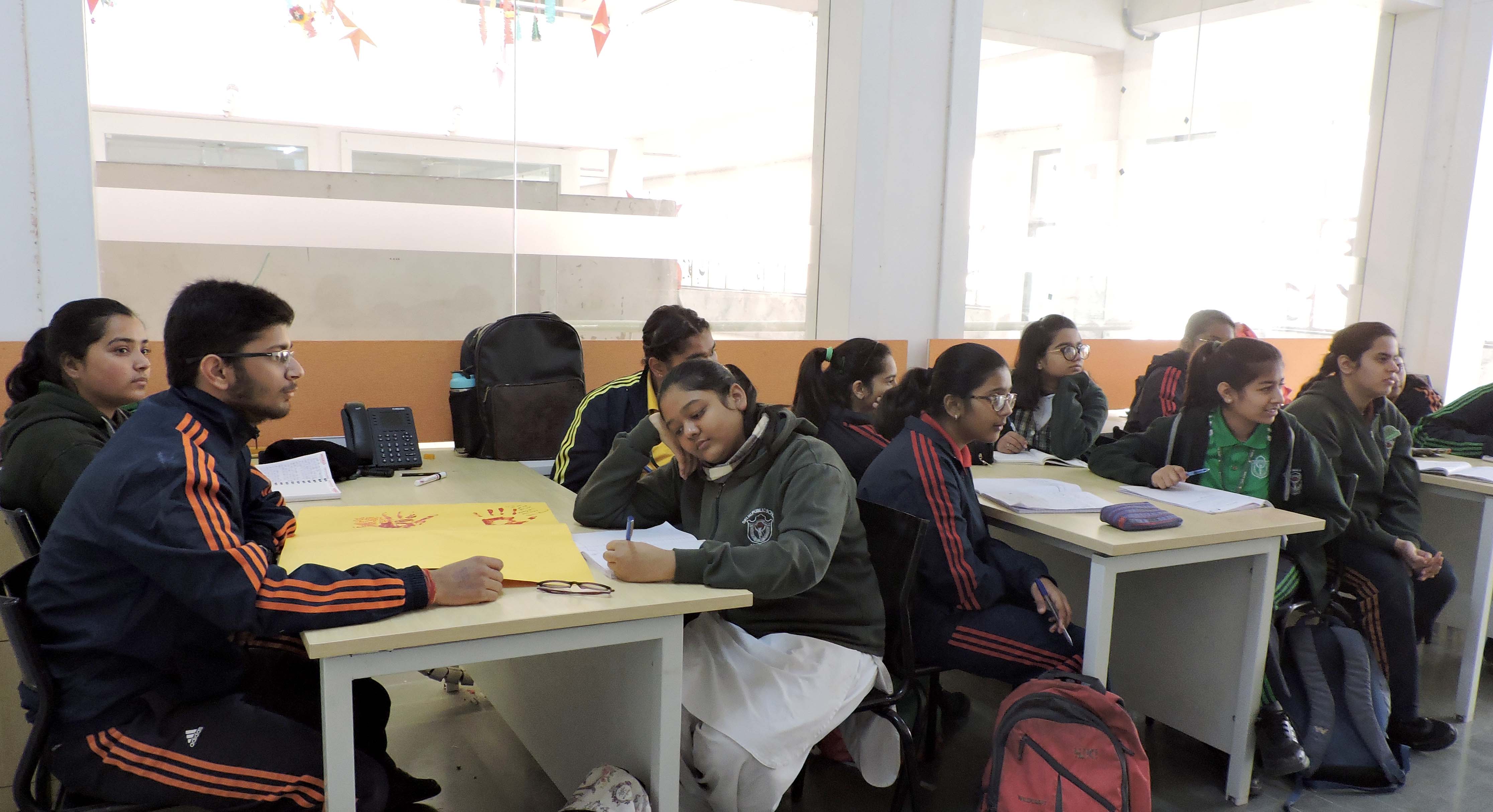 DPS Agra students showcasing handmade book covers for Quill Club book project